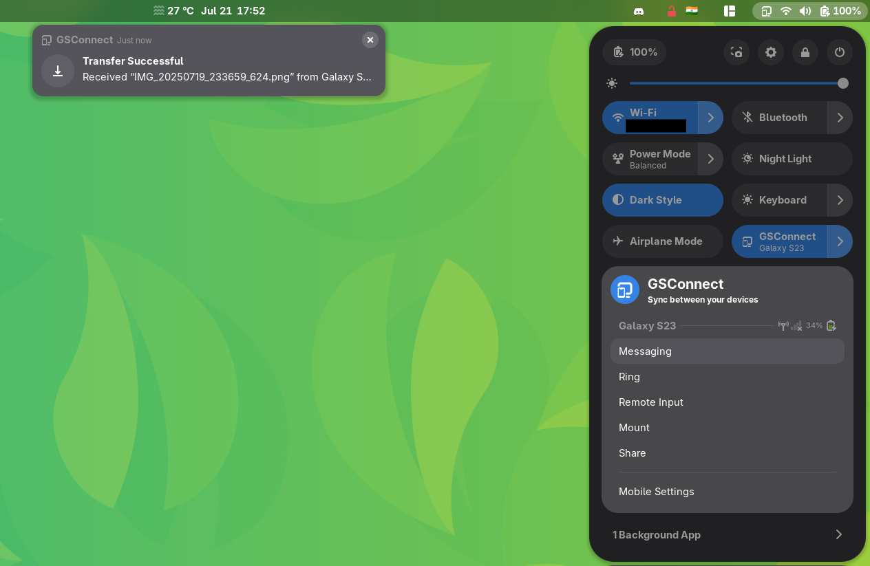gsconnect running on a gnome system, used to succesfully receive a file from a galaxy s23 device, the main app is shown towards the right, in the quick access settings dialog of gnome